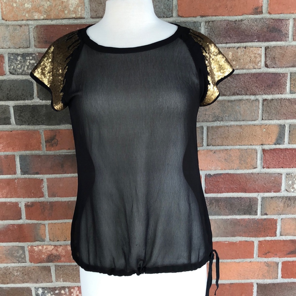 Black shirt with gold sleeve embellishments